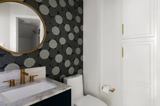 a bathroom with a toilet and a sink