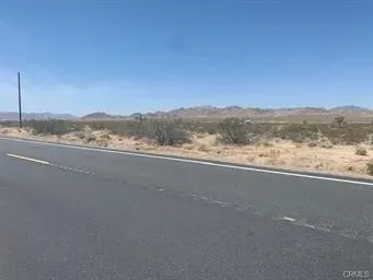 a view of an ocean and a mountain