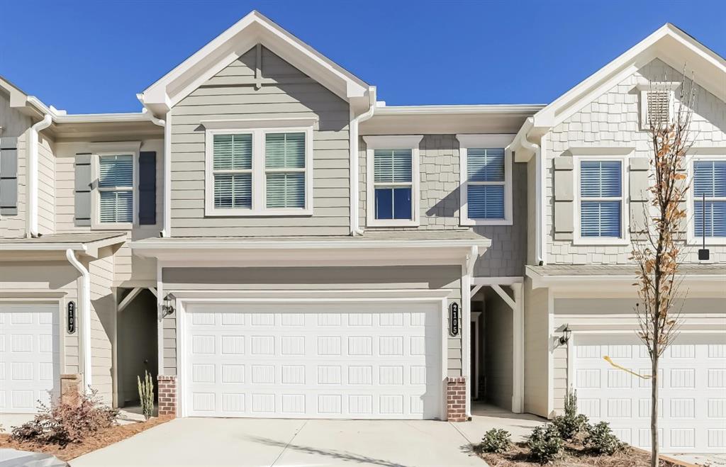 2150 Spring Rush Drive, Unit 127 Buford, GA 30519 - Photo 13 of 15 a view of a white house with large windows