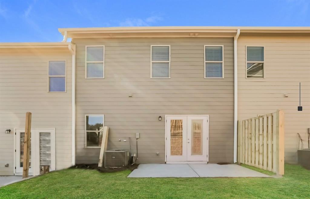 2150 Spring Rush Drive, Unit 127 Buford, GA 30519 - Photo 14 of 15 a front view of a house with a yard