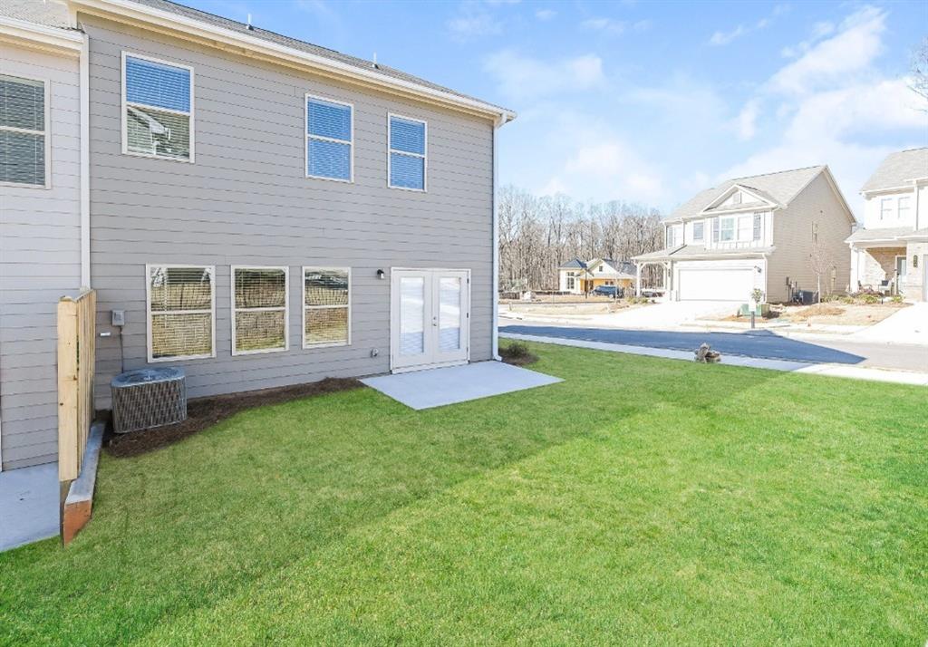 2150 Spring Rush Drive, Unit 127 Buford, GA 30519 - Photo 15 of 15 a view of a house with a yard and sitting area