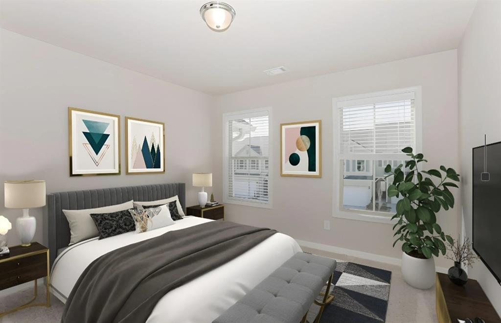 2150 Spring Rush Drive, Unit 127 Buford, GA 30519 - Photo 7 of 15 a bedroom with a bed and a potted plant