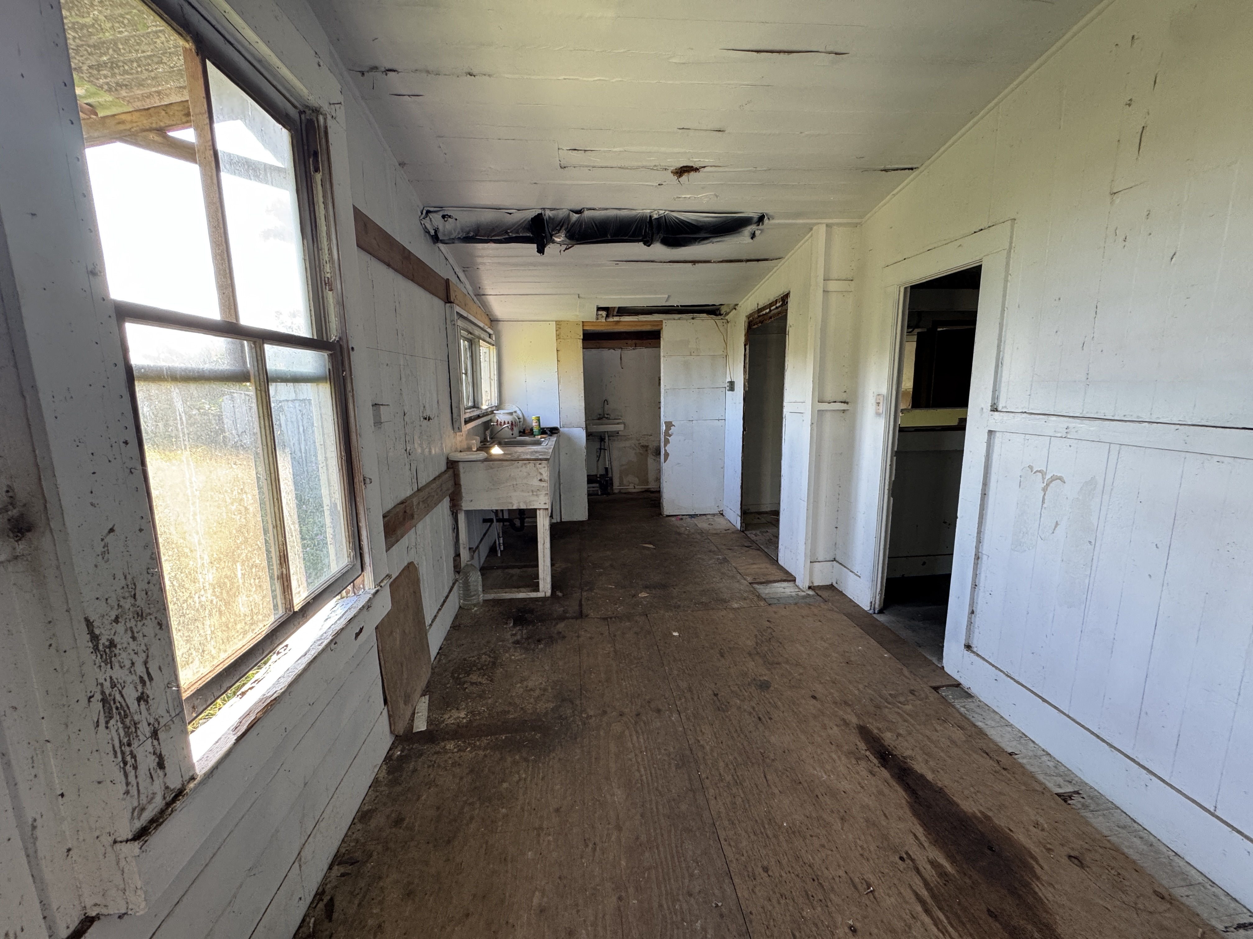 18-1253 Volcano Road Mountain View, HI 96771 - Photo 19 of 23 a view of a hallway with furniture and windows