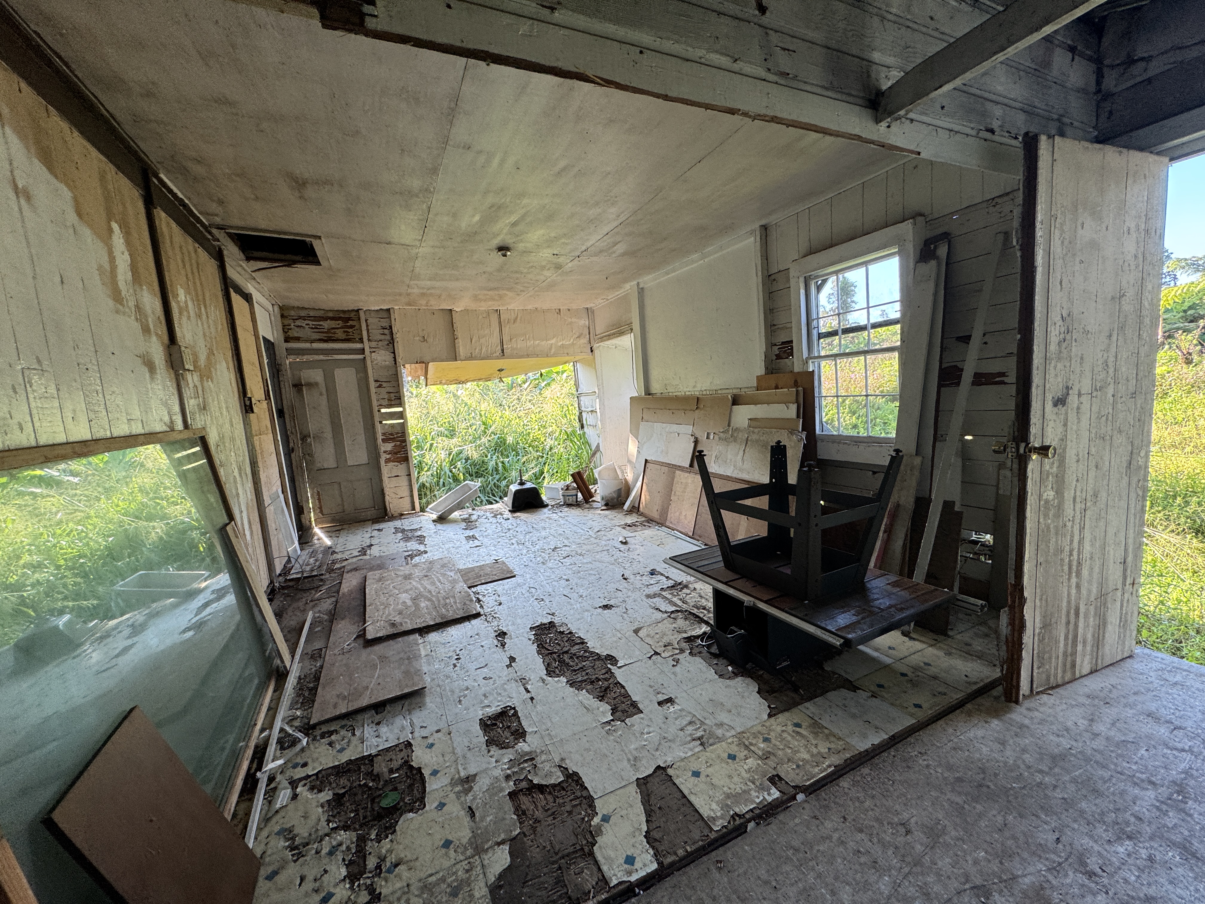 18-1253 Volcano Road Mountain View, HI 96771 - Photo 22 of 23 a view of a livingroom with furniture and front door