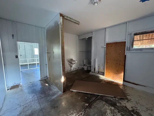 a view of an empty room with a window