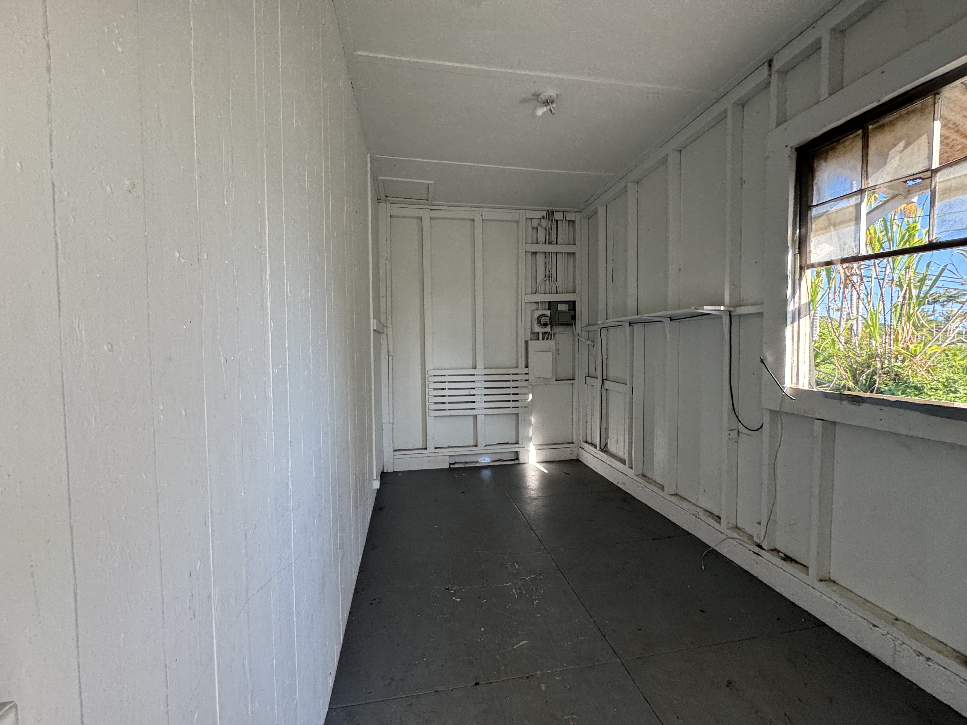 18-1253 Volcano Road Mountain View, HI 96771 - Photo 7 of 23 a view of an empty room with a window