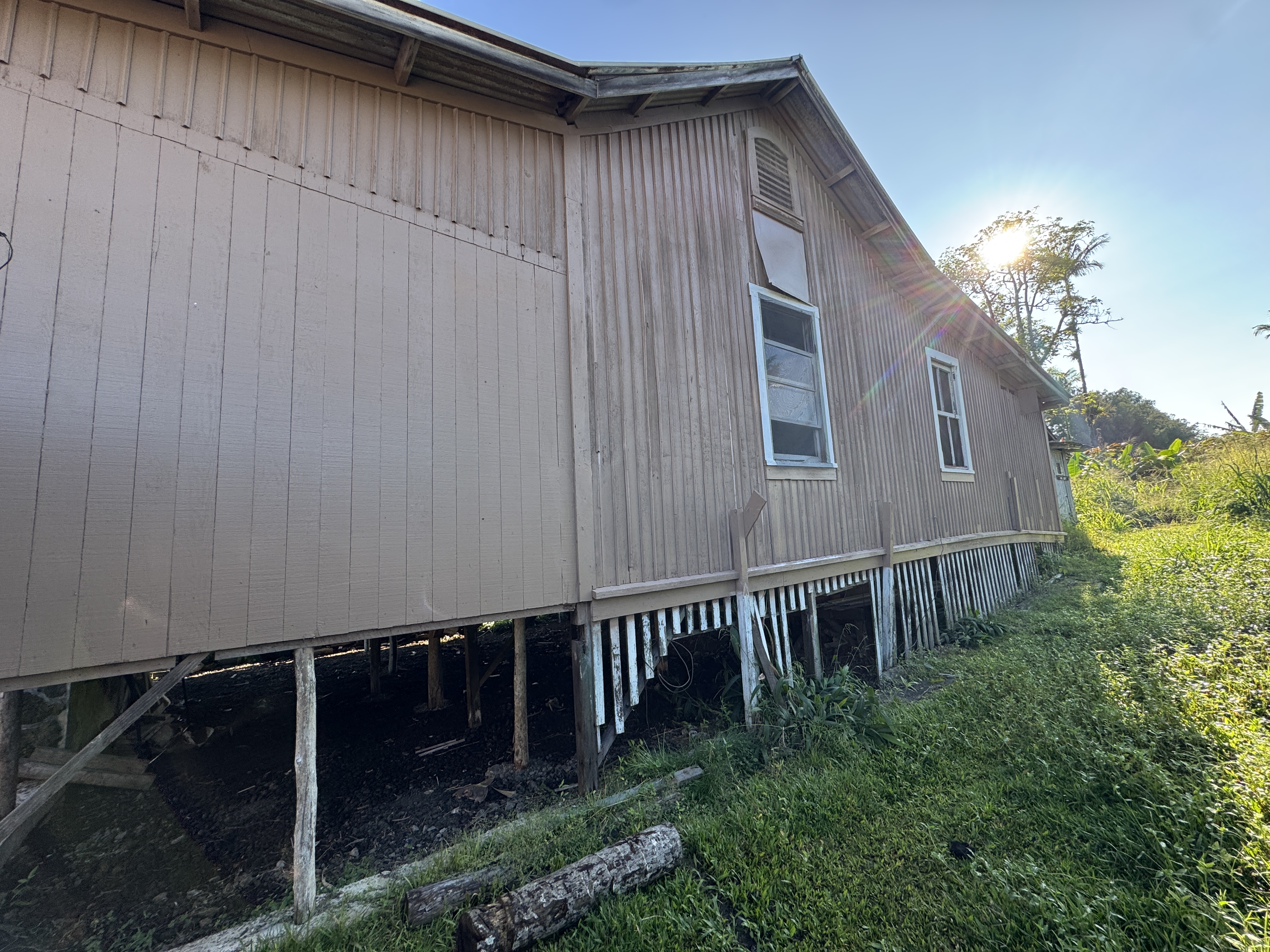 18-1253 Volcano Road Mountain View, HI 96771 - Photo 10 of 23 a backyard of a house with lots of green space