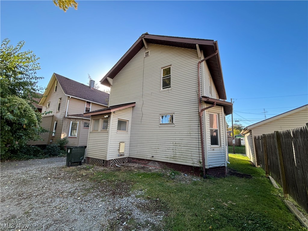 2711 11th Street Northwest Canton, OH 44708 - Photo 4 of 16 Rear view of house featuring a yard