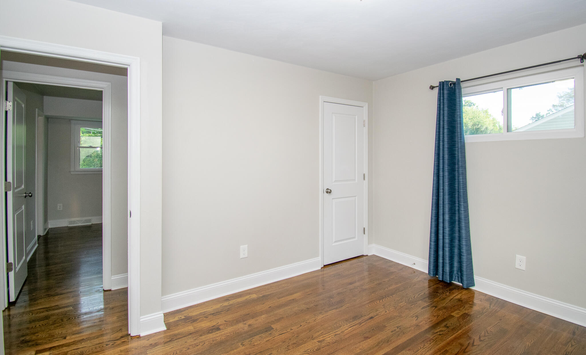 5409 Gieser Road Roanoke, VA 24018 - Photo 22 of 46 an empty room with wooden floor and a window