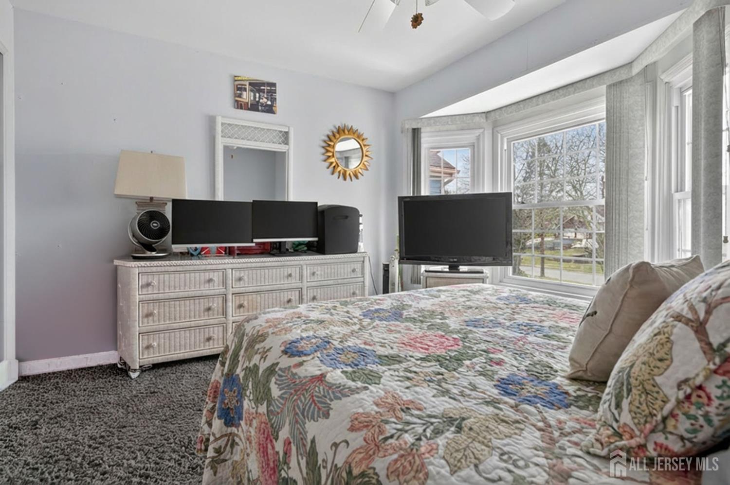 5 Scarborough Road, Unit D Monroe Township, NJ 08831 - Photo 15 of 28 a bedroom with a bed and flat screen tv