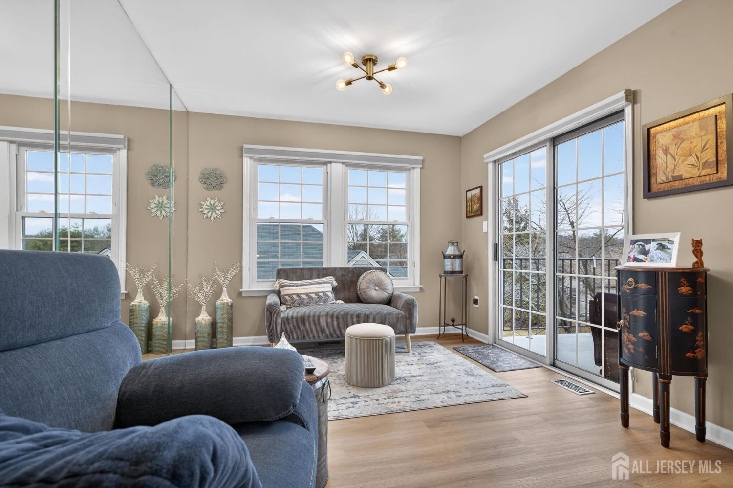 5 Scarborough Road, Unit D Monroe Township, NJ 08831 - Photo 2 of 28 a living room with furniture and wooden floor