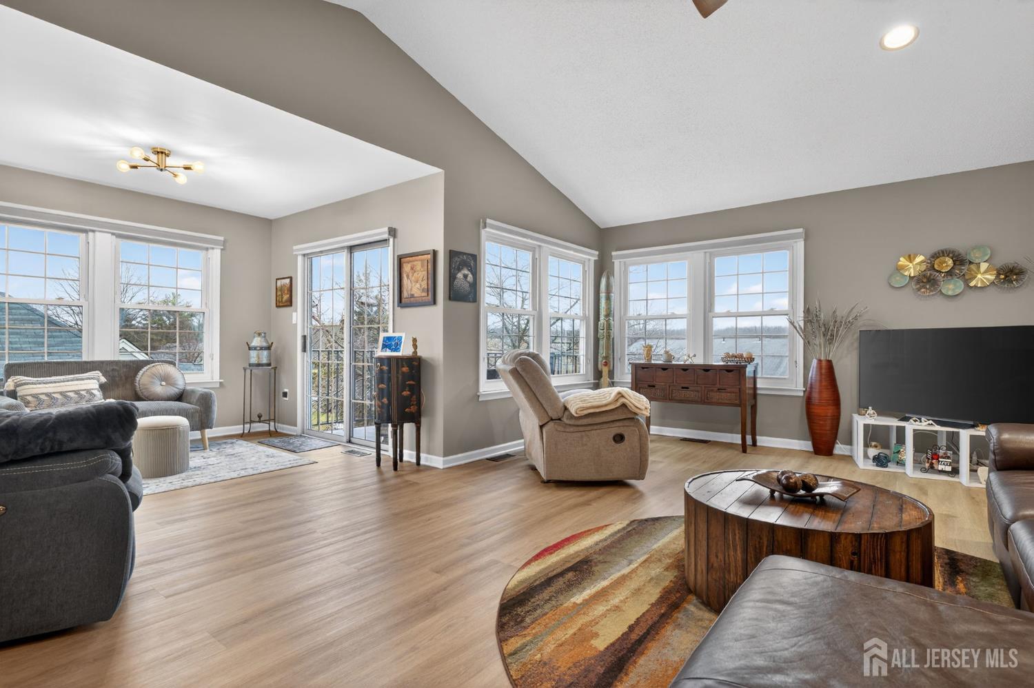 5 Scarborough Road, Unit D Monroe Township, NJ 08831 - Photo 7 of 28 a living room with furniture and wooden floor