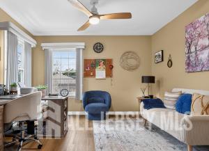 5 Scarborough Road, Unit D Monroe Township, NJ 08831 - Photo 10 of 28 a living room with furniture and a large window