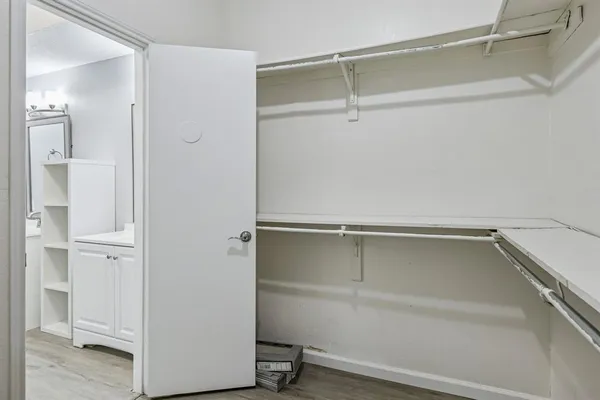 a view of an empty walk in closet