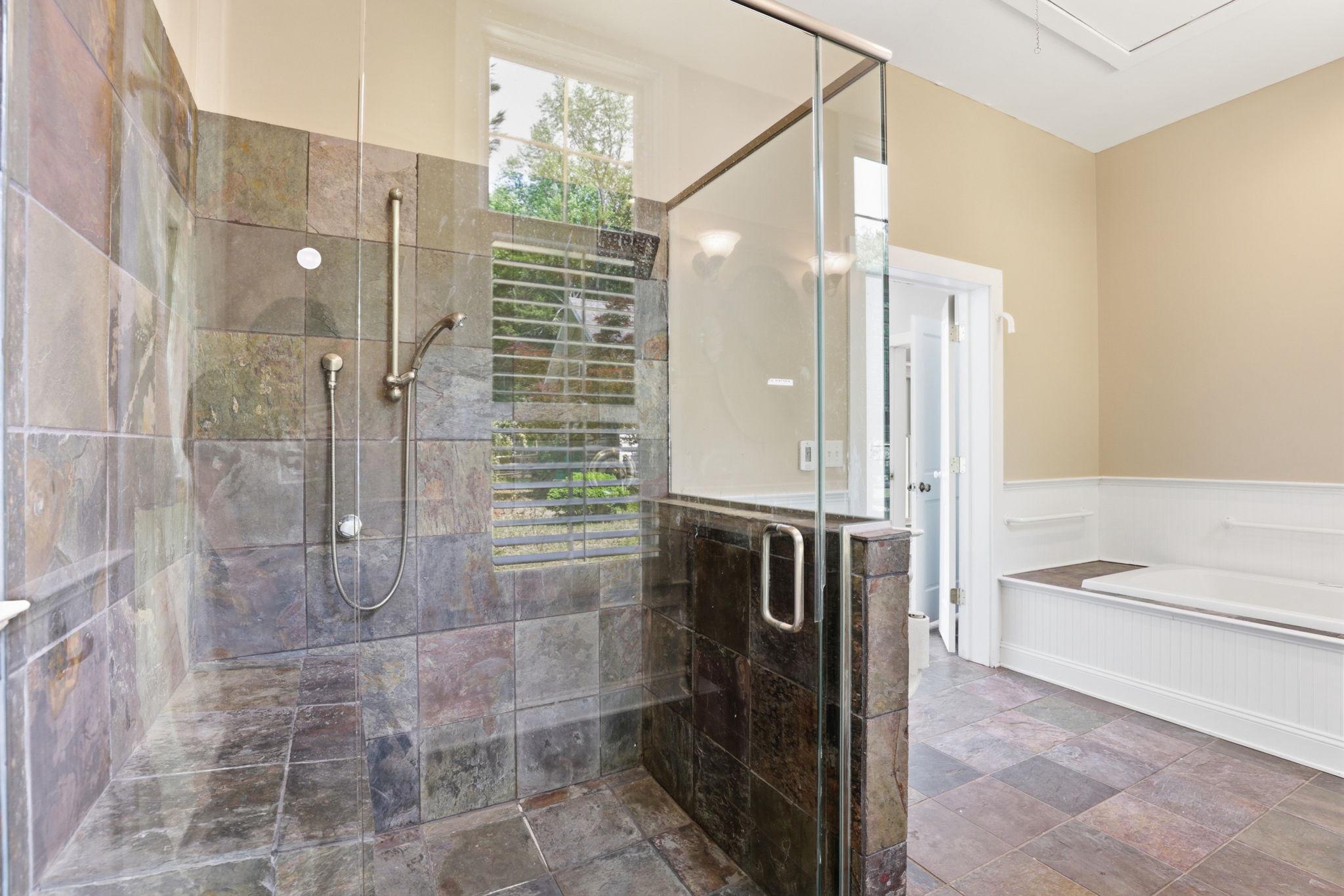 5865 Deale Beach Road Deale, MD 20751 - Photo 19 of 45 Elegant slate-tiled shower in primary suite.