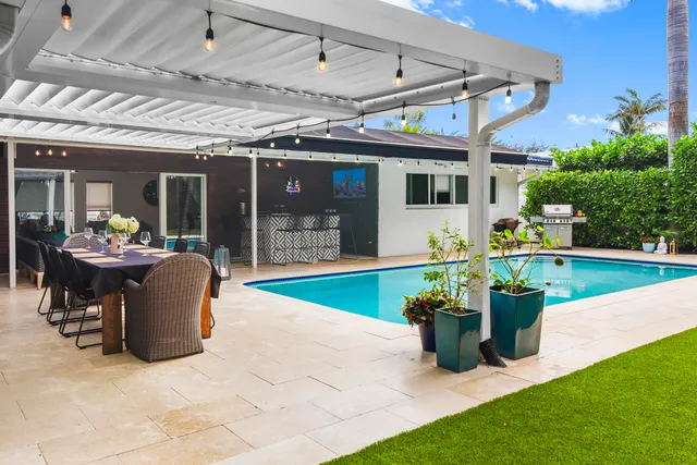 a view of a patio with a table and chairs
