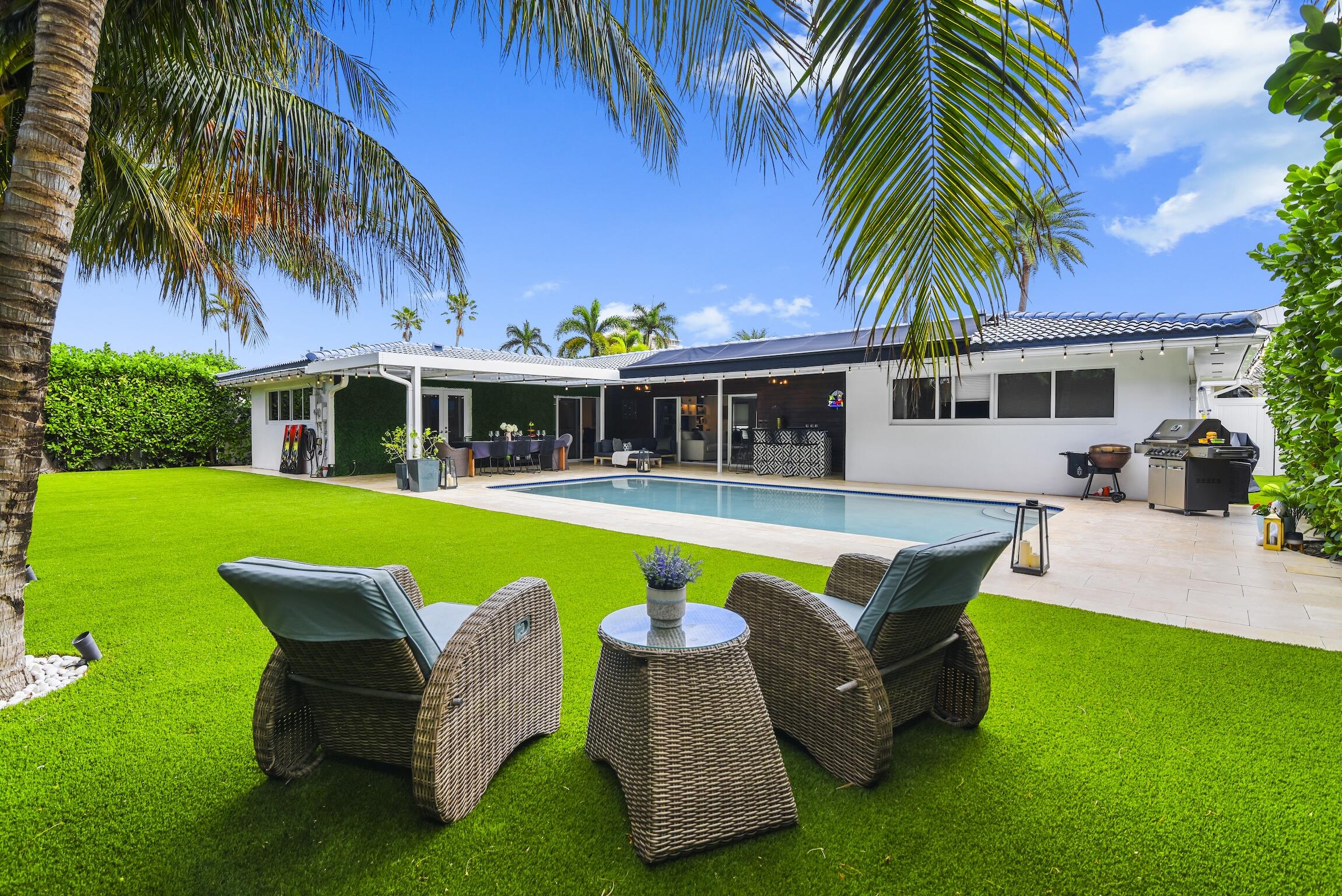 3481 Northeast 31st Avenue Lighthouse Point, FL 33064 - Photo 19 of 33 a view of a house with a swimming pool and sitting area