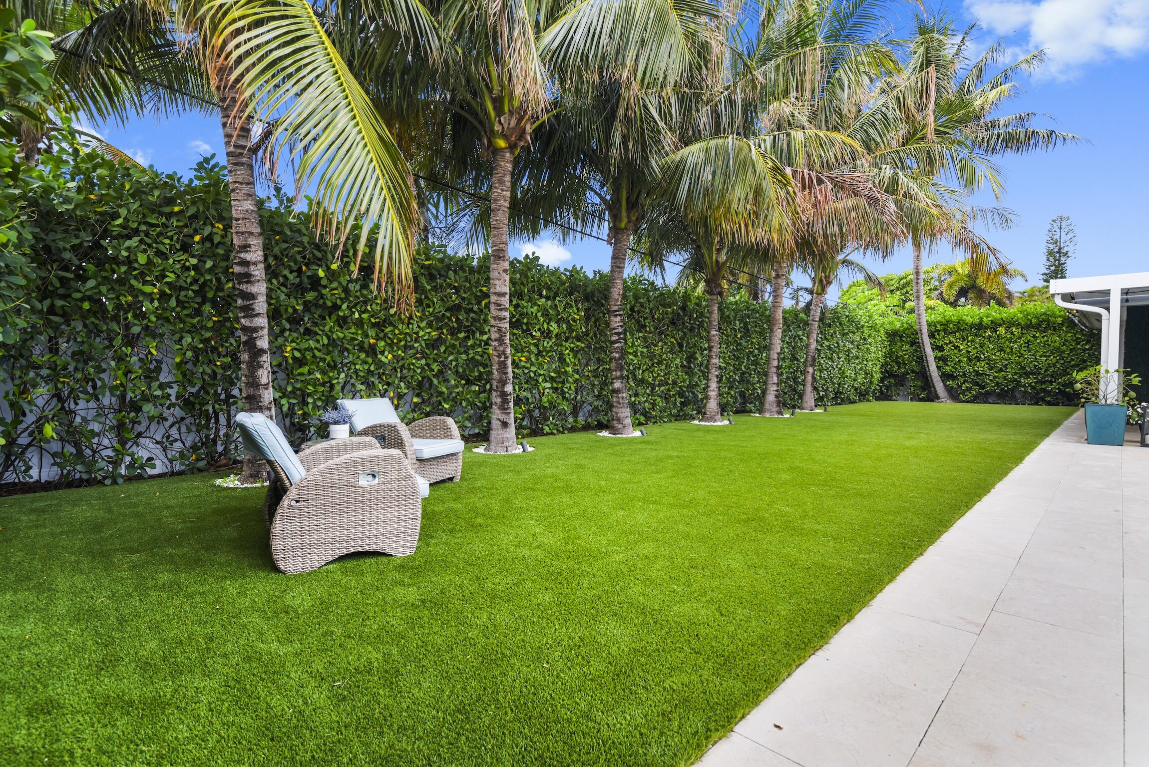 3481 Northeast 31st Avenue Lighthouse Point, FL 33064 - Photo 21 of 33 a garden view with a seating space