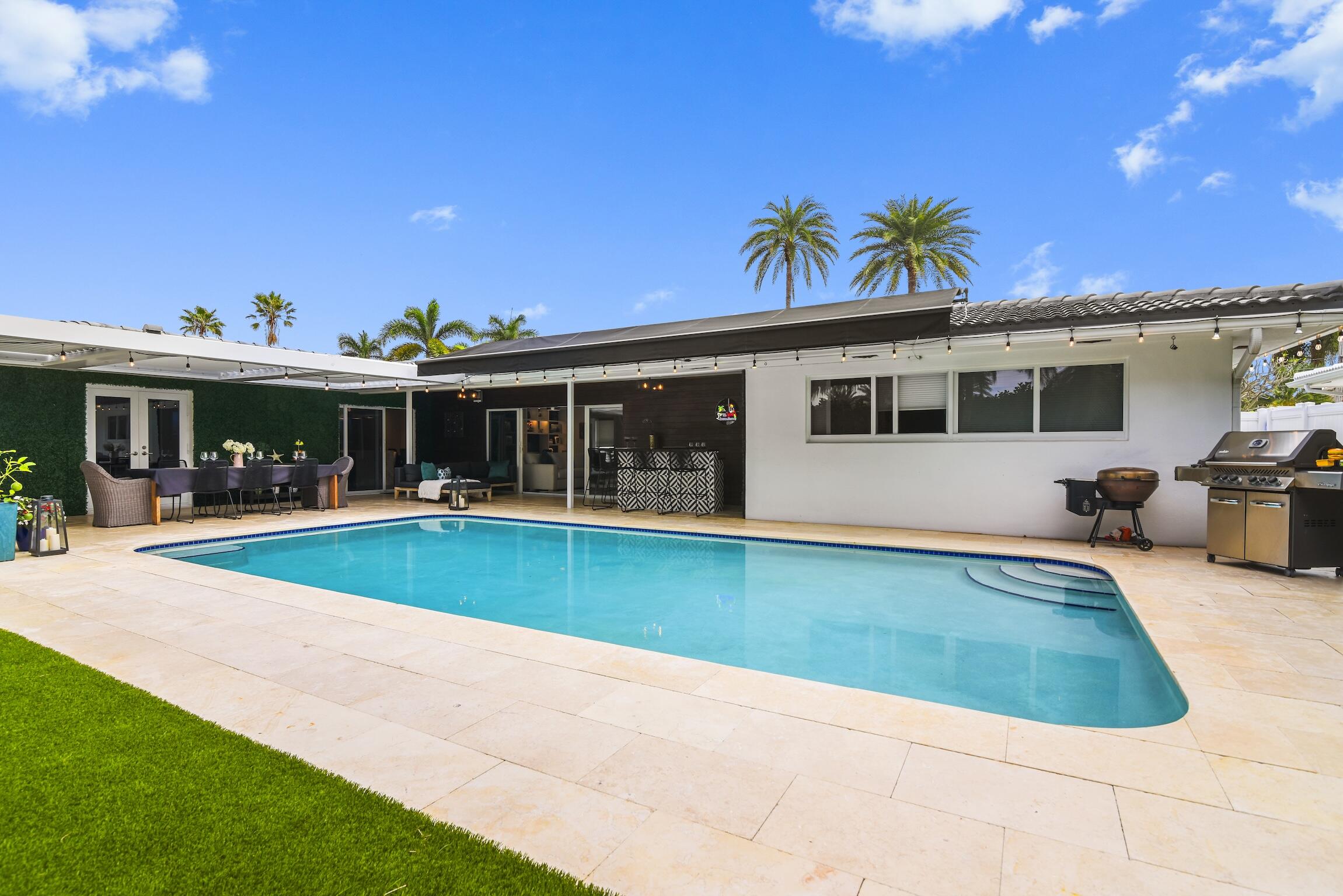 3481 Northeast 31st Avenue Lighthouse Point, FL 33064 - Photo 23 of 33 a view of pool with outdoor seating