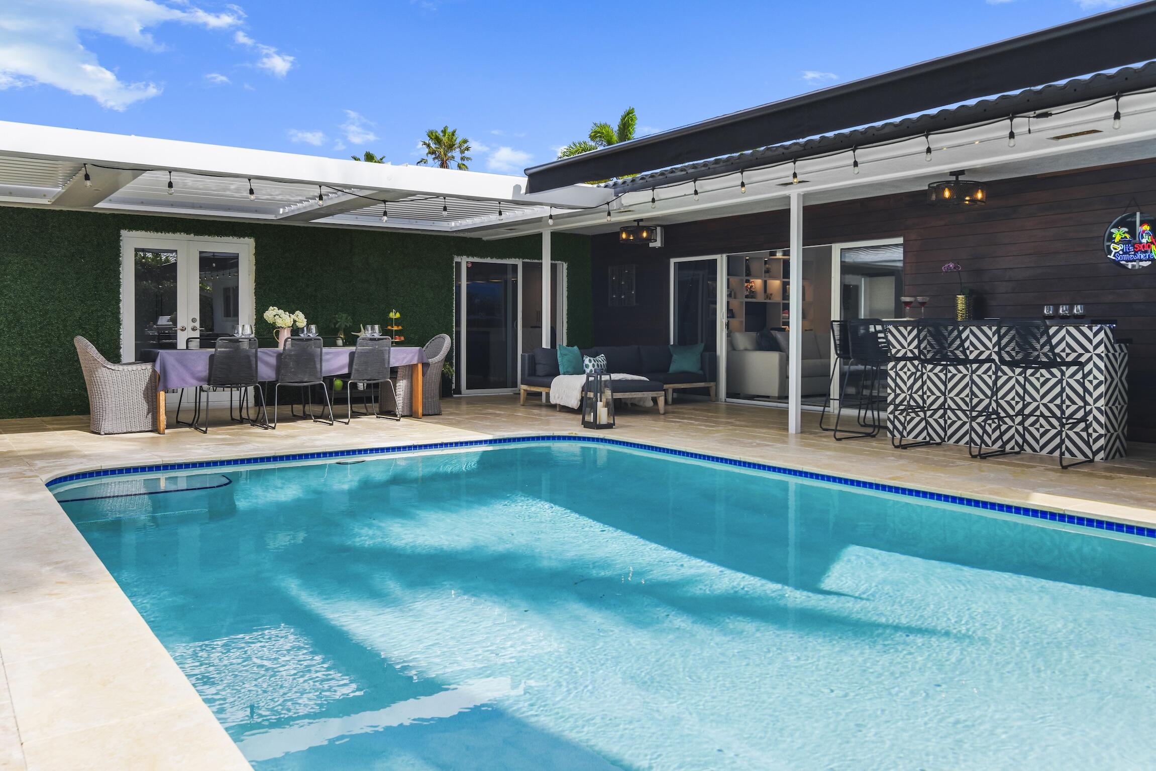 3481 Northeast 31st Avenue Lighthouse Point, FL 33064 - Photo 24 of 33 a view of a house with swimming pool and sitting area