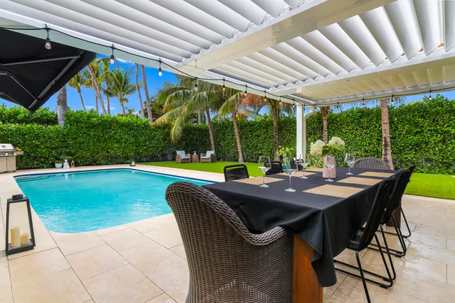 a view of a patio with a table chairs and a table