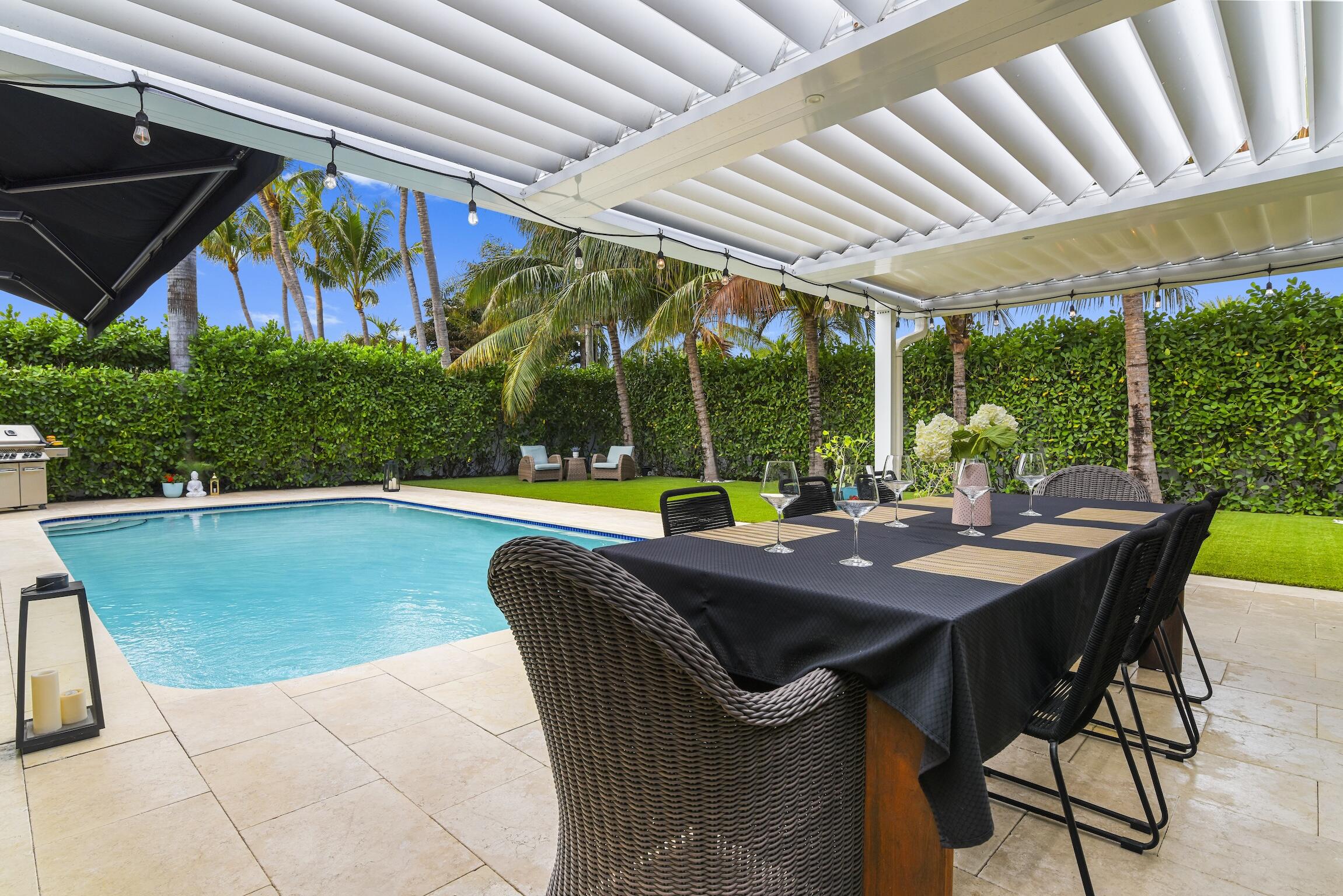 3481 Northeast 31st Avenue Lighthouse Point, FL 33064 - Photo 27 of 33 a view of a patio with a table chairs and a table
