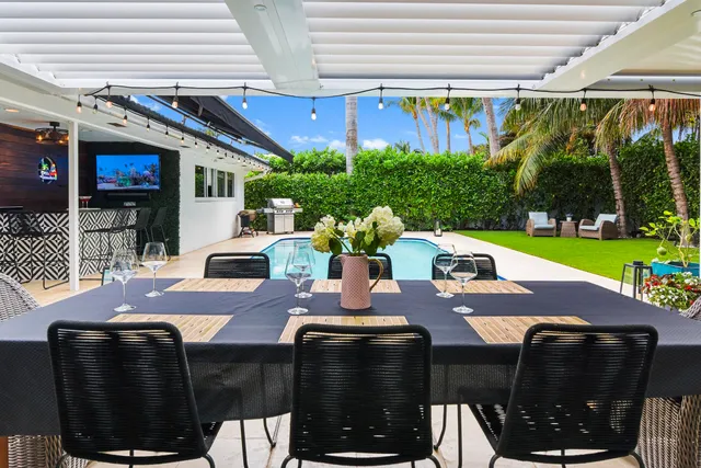 a view of an outside dining space with furniture