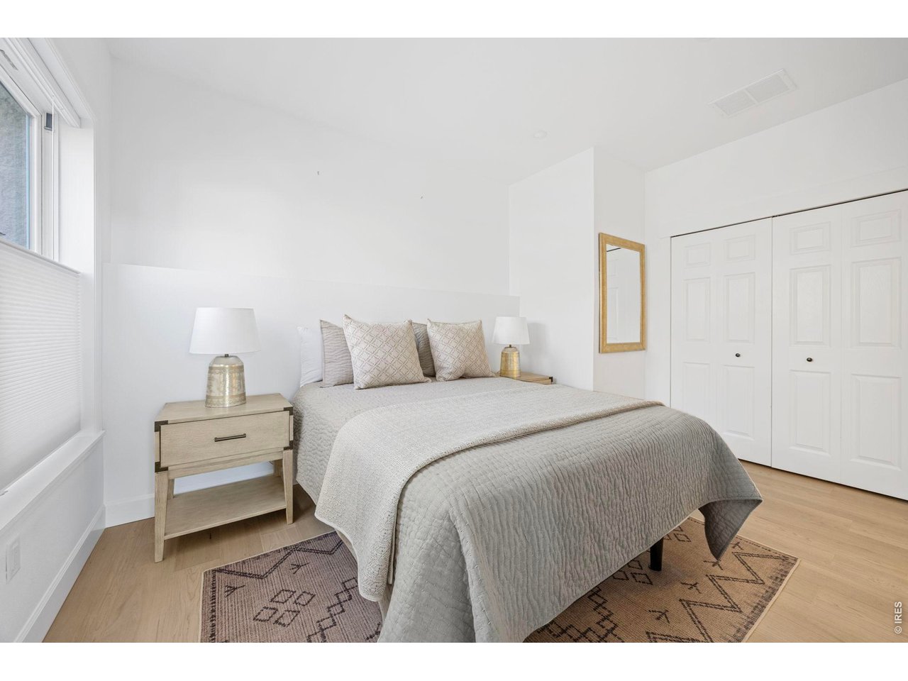 4655 13th Street Boulder, CO 80304 - Photo 13 of 23 a bedroom with a bed and a night stand