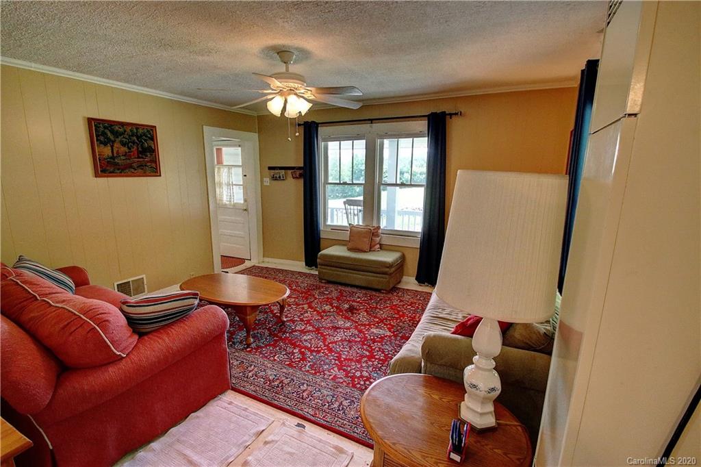 24 Belmont Church Road Clyde, NC 28721 - Photo 14 of 44 a living room with furniture and a rug