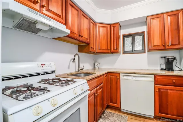 a kitchen with a stove and a sink