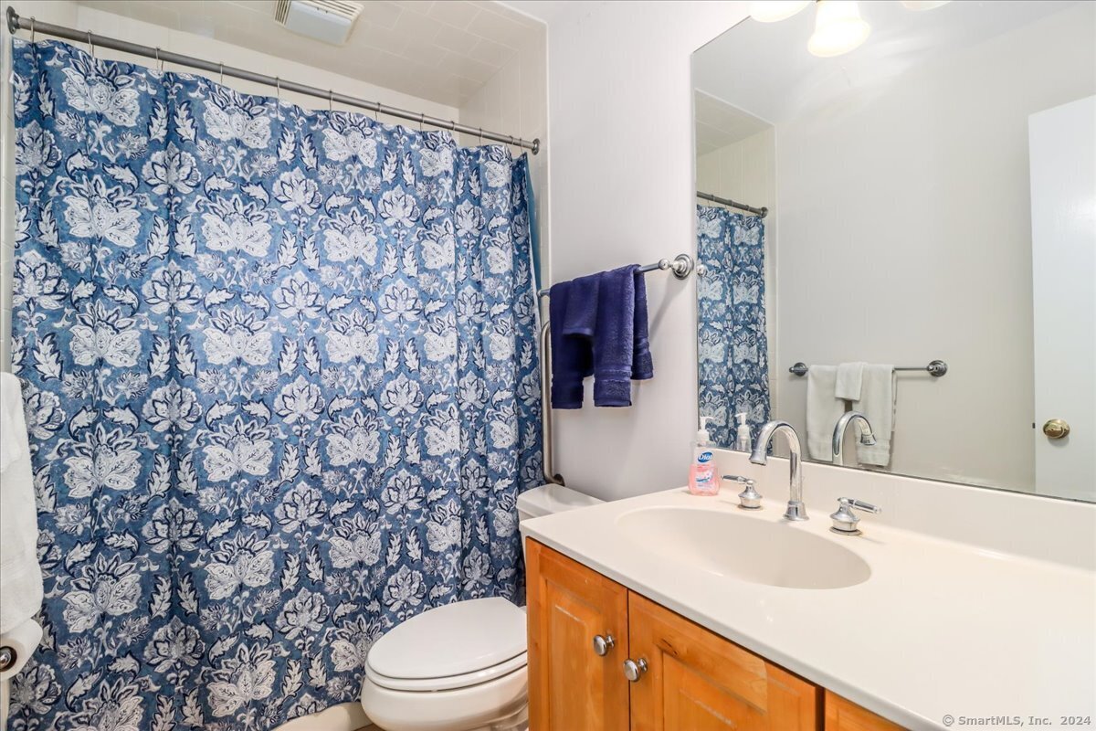 22 Olcott Way, Unit 22 Ridgefield, CT 06877 - Photo 15 of 20 a bathroom with a sink toilet and shower