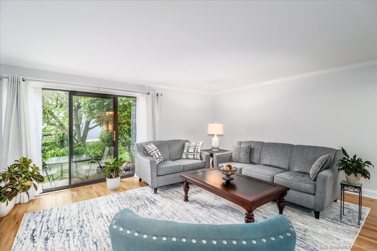 22 Olcott Way, Unit 22 Ridgefield, CT 06877 - Photo 9 of 20 a living room with furniture and a large window