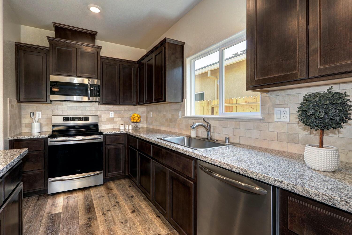 1140 North Palmer Road Galt, CA 95632 - Photo 12 of 17 *Kitchen with Granite Counters, Island, Stainless Steel Appliances