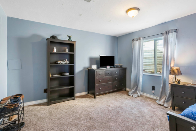 13176 Day Court Draper, UT 84020 - Photo 29 of 45 Bedroom featuring light carpet and baseboards