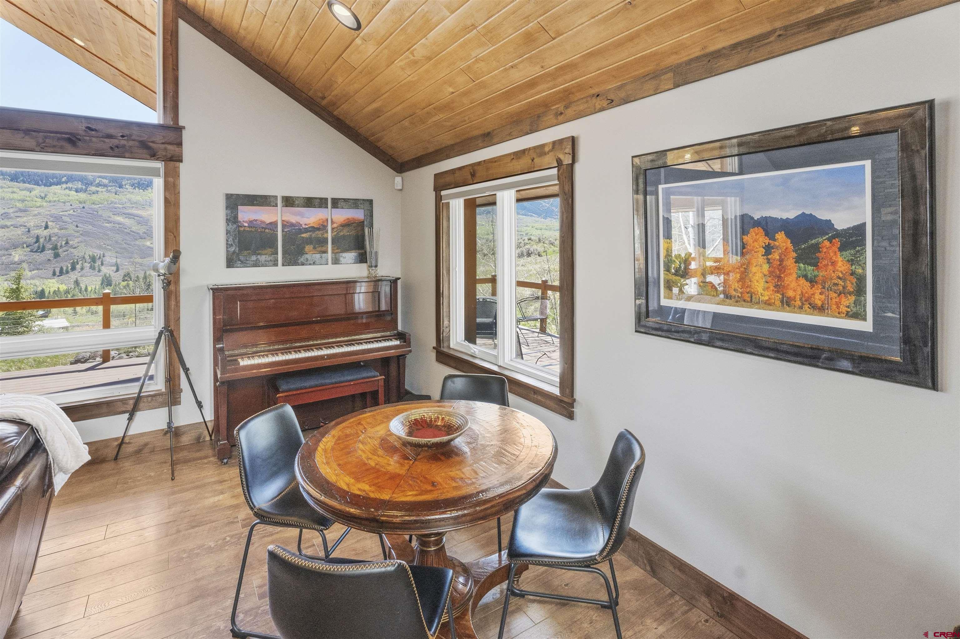 684 Falcon Way Montrose, CO 81403 - Photo 11 of 43 a view of a dining room with furniture window and outside view