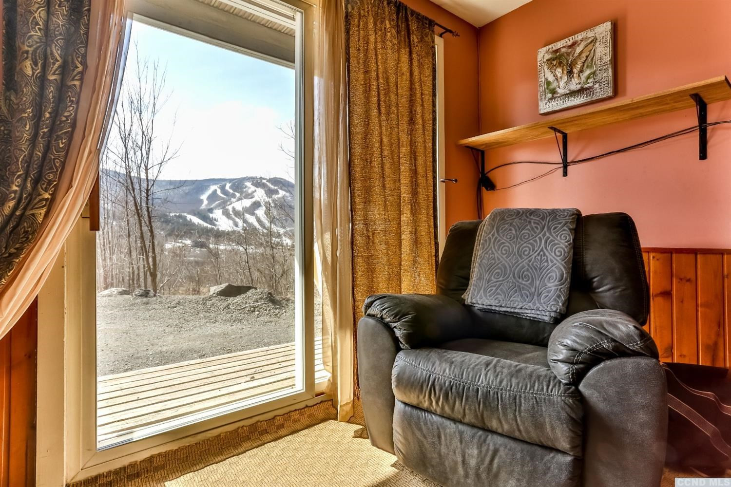 13 Scribner Hollow Road, Unit B1 Hunter, NY 12442 - Photo 28 of 37 a living room with furniture and a window