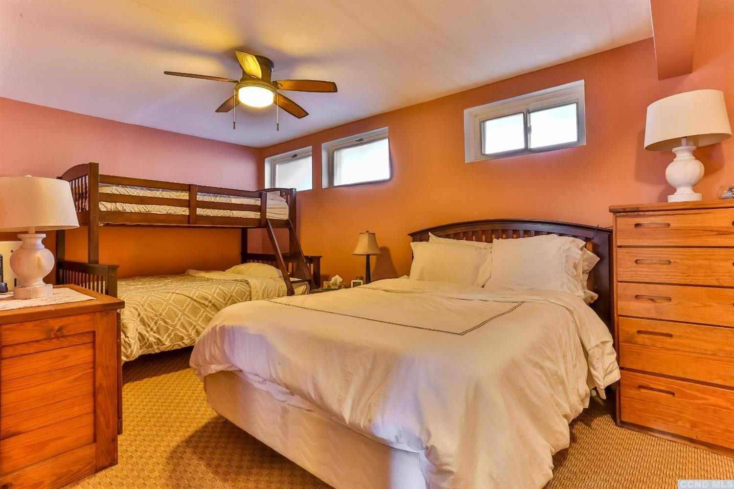 13 Scribner Hollow Road, Unit B1 Hunter, NY 12442 - Photo 29 of 37 a bedroom with two beds and ceiling fan