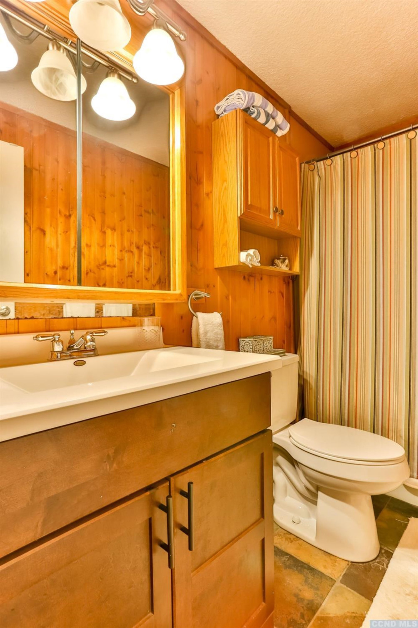 13 Scribner Hollow Road, Unit B1 Hunter, NY 12442 - Photo 30 of 37 a bathroom with a sink a toilet and a large mirror