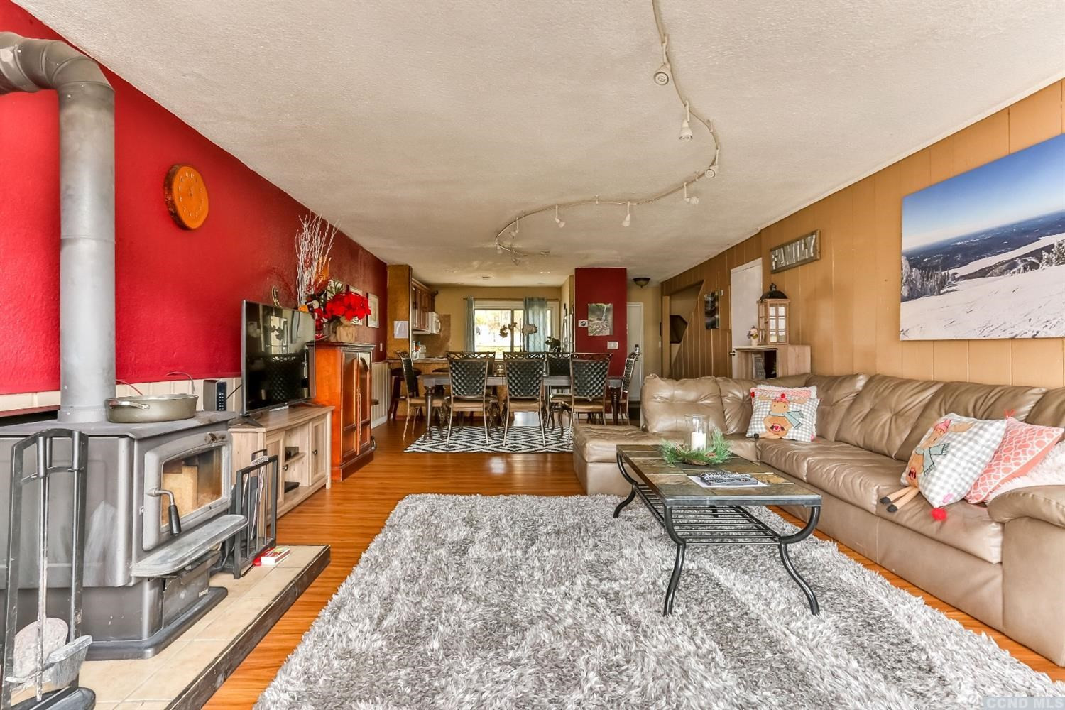13 Scribner Hollow Road, Unit B1 Hunter, NY 12442 - Photo 10 of 37 a living room with furniture flat screen tv and a fireplace