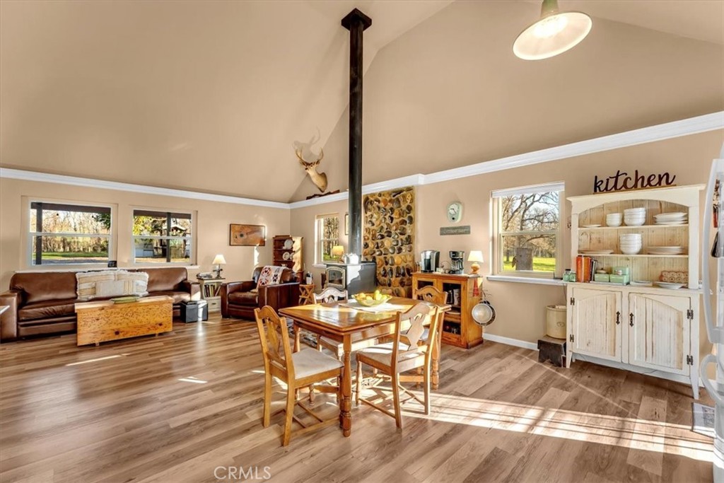 18810 Phyllis Road Cottonwood, CA 96022 - Photo 17 of 71 a view of a dining room with furniture window and wooden floor