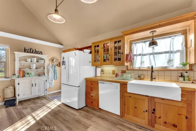 a bathroom with a granite countertop shower a toilet and a sink