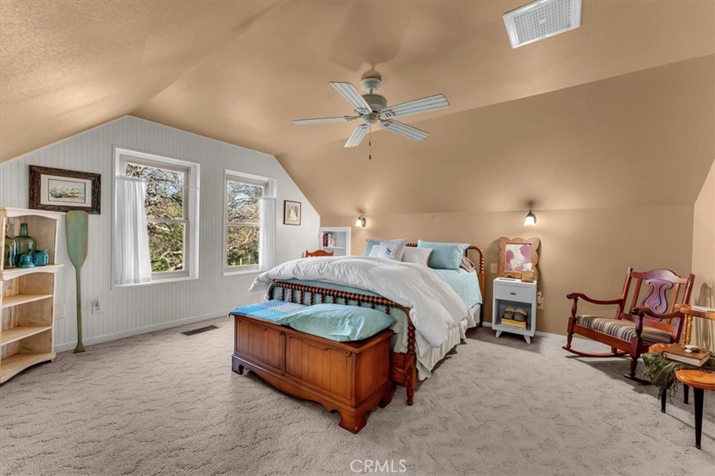 18810 Phyllis Road Cottonwood, CA 96022 - Photo 19 of 71 a spacious bedroom with a bed a window and dresser