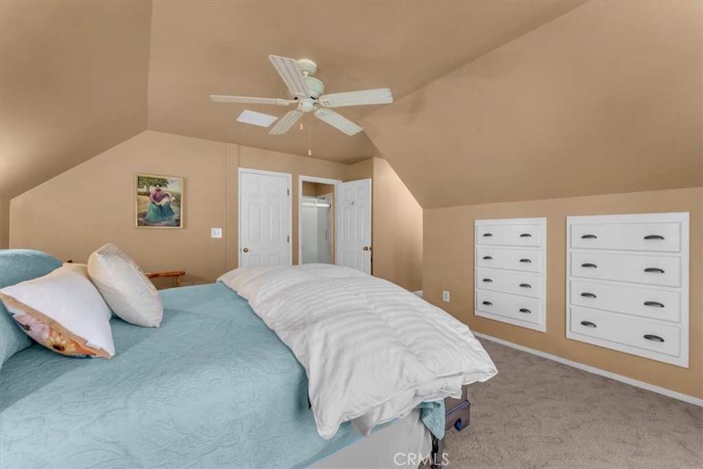 18810 Phyllis Road Cottonwood, CA 96022 - Photo 21 of 71 a spacious bedroom with a bed and a walk in closet