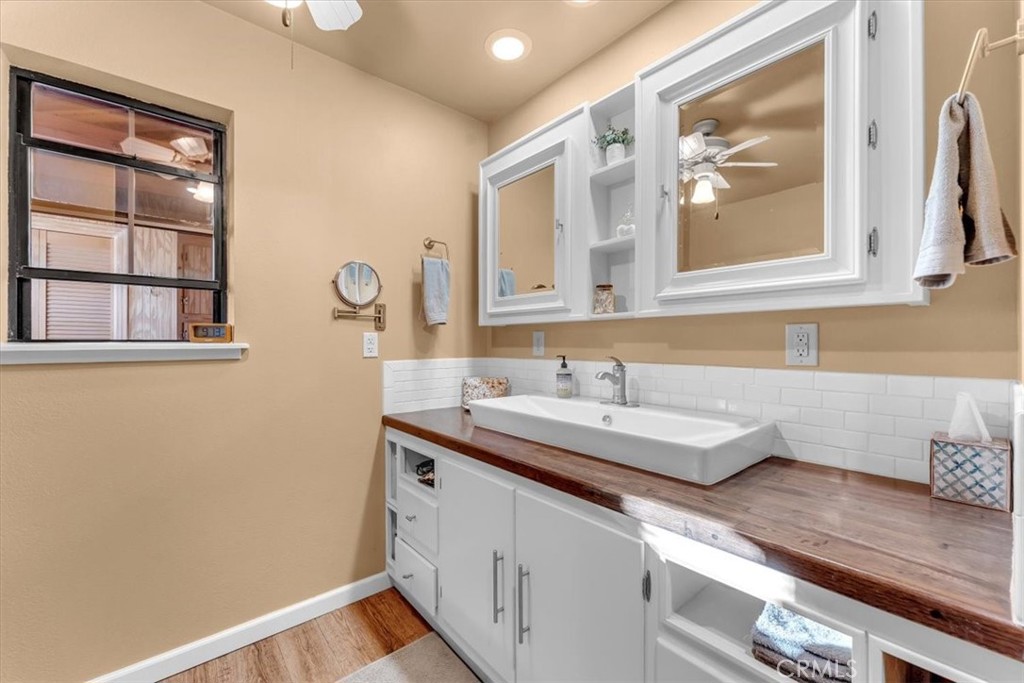 18810 Phyllis Road Cottonwood, CA 96022 - Photo 24 of 71 a bathroom with a sink and a mirror