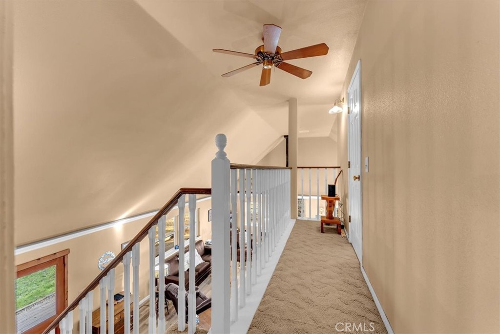 18810 Phyllis Road Cottonwood, CA 96022 - Photo 26 of 71 a view of a hallway with wooden floor and stairs