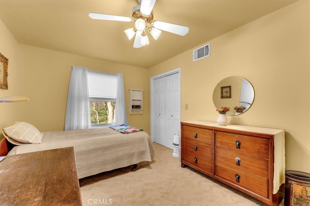 18810 Phyllis Road Cottonwood, CA 96022 - Photo 29 of 71 a bedroom with a bed and a dresser