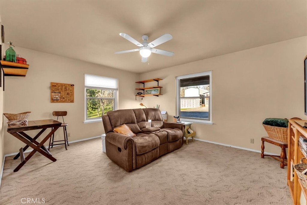 18810 Phyllis Road Cottonwood, CA 96022 - Photo 30 of 71 a living room with furniture and a window