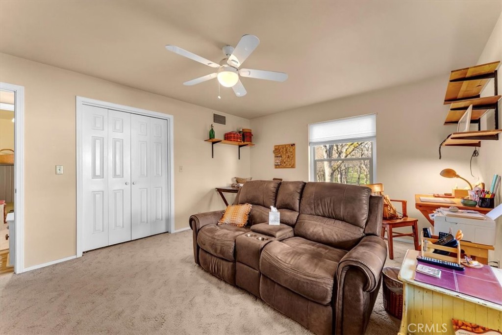 18810 Phyllis Road Cottonwood, CA 96022 - Photo 31 of 71 a living room with furniture and a window