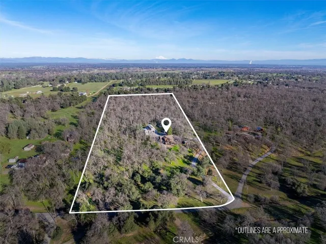a view of an entryway with wooden floor and a front door