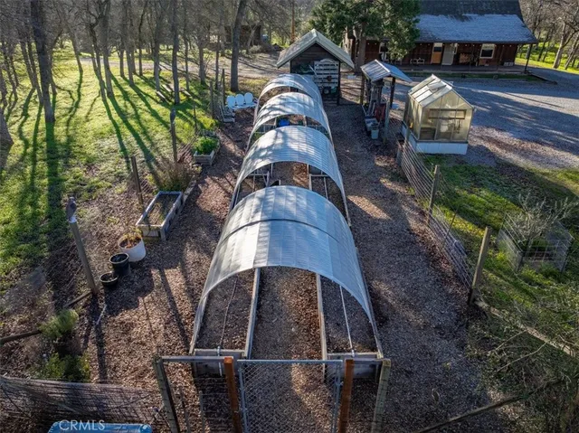 a dining room with furniture and large windows